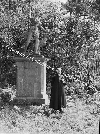 REV T COUNIHAN S.J. AT STATUE IN ST MARY'S EMO